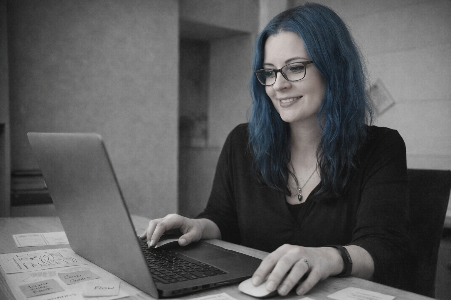 Chantal Forssman working at laptop, learning experience design environment